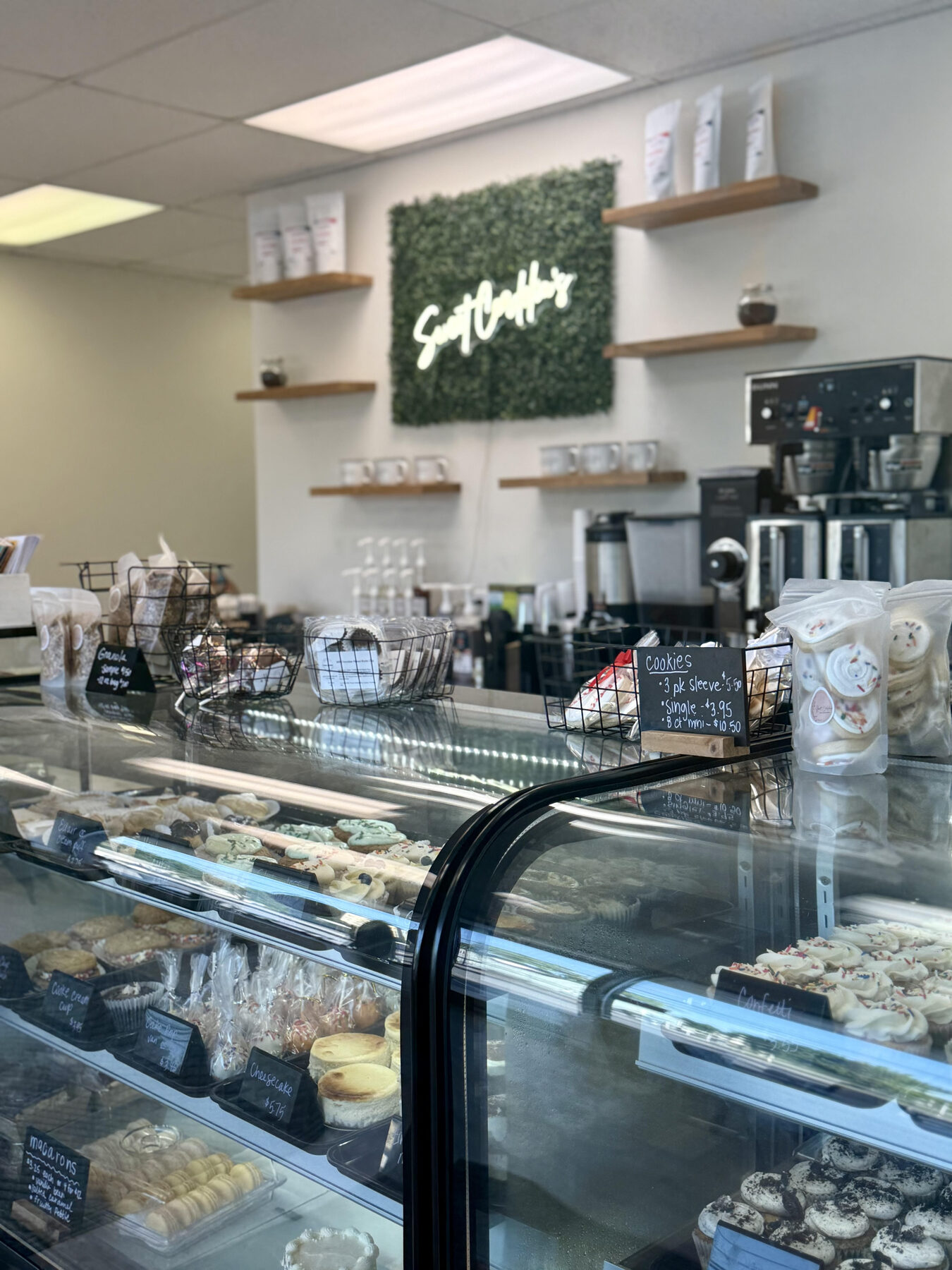 Inside Sweet Cordelia's: a bright display case filled with fresh baked goods